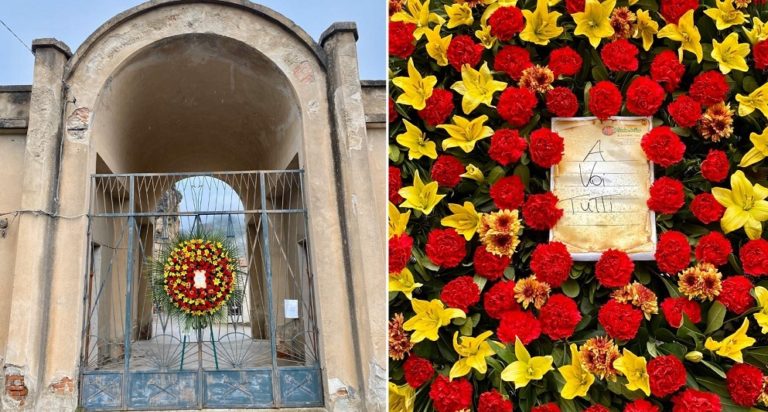 “A voi tutti”, una ghirlanda di fiori sulla porta del cimitero di Militello Rosmarino